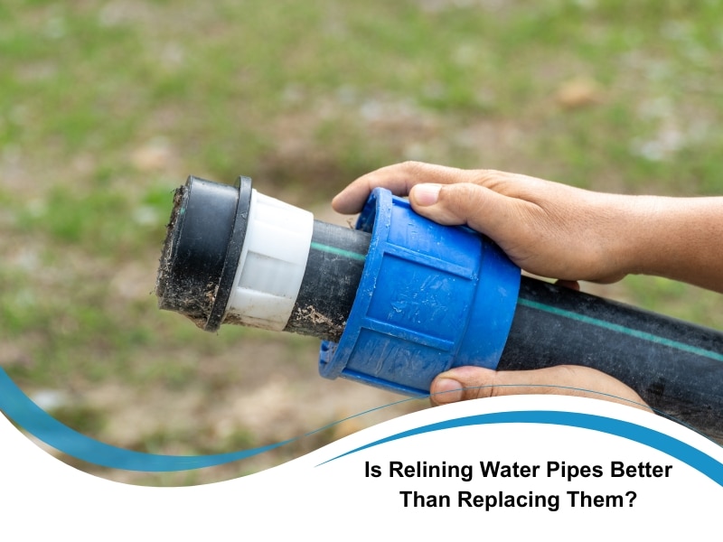 Hands holding plastic pipe joint used for relining water pipes.
